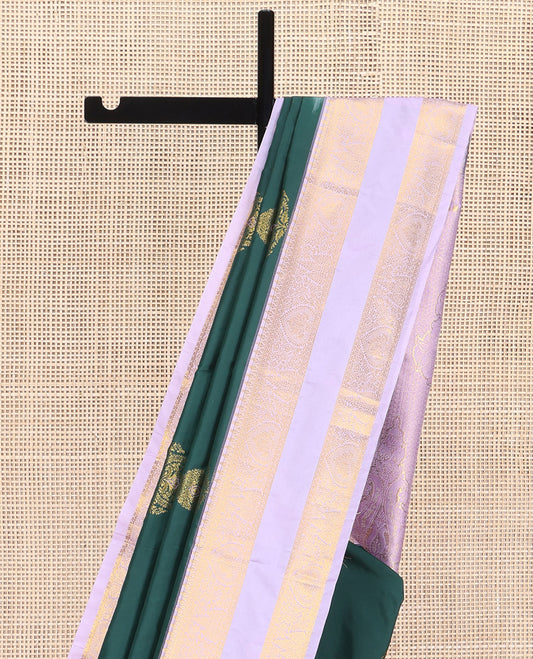 Green Budget Silk Saree, Gracefully Embellished with Meena Buttas All Over Its Body, Complemented by Contrast Traditional Zari Design Rettai Pettu Border, Intricately Designed Pallu, and Paired with a Contrast Blouse