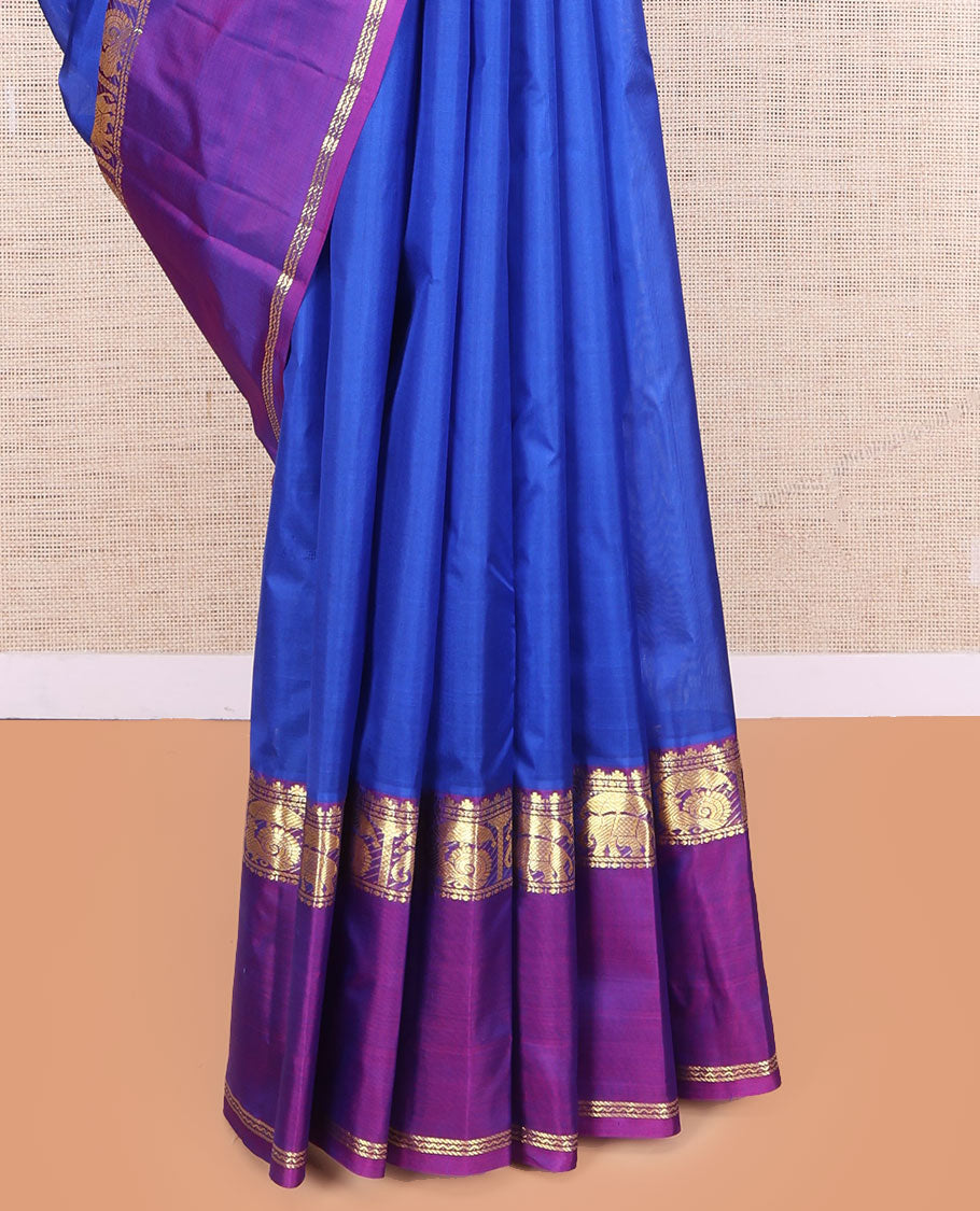 Royal Blue Plain Kanchipuram Silk Saree, a Contrast Rettai Pettu Border of Thazampoo Rekku, Banaras, Neli, Mayil, and Yaanai Designs , Zari Design Pallu, and a Contrast Blouse