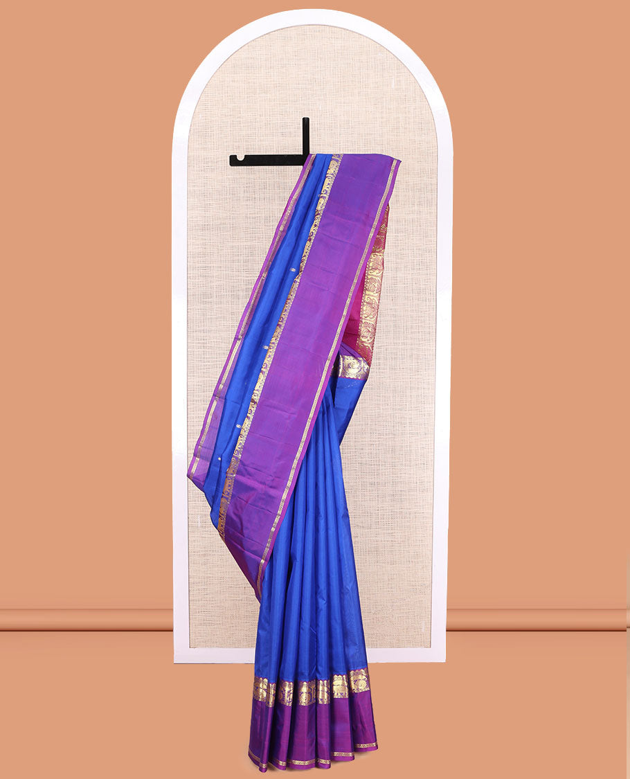 Royal Blue Plain Kanchipuram Silk Saree, a Contrast Rettai Pettu Border of Thazampoo Rekku, Banaras, Neli, Mayil, and Yaanai Designs , Zari Design Pallu, and a Contrast Blouse
