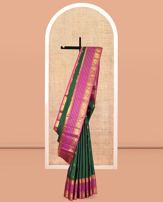Green Kanchipuram Silk Saree, Adorned with Manga Buttas, a Contrast Korvai Border of Thilakam, Muthu, Vanki, Diamond, Kathir, and Mayil Designs, Jaal Pallu, and a Contrast Blouse
