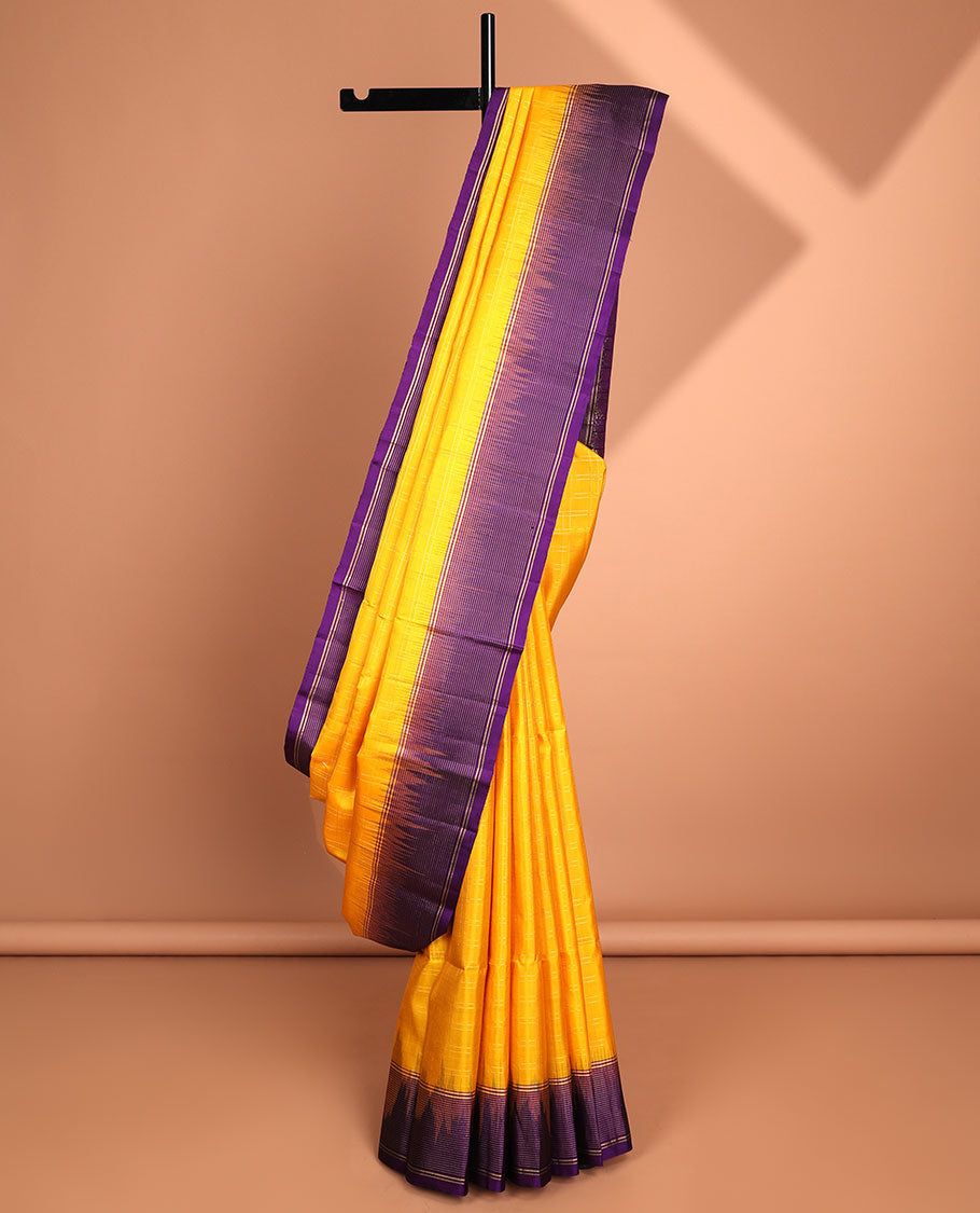 Yellow soft silk saree with contrast striped zari border & intricate zari design pallu