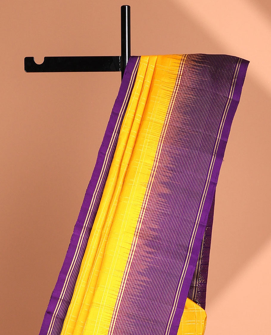 Yellow soft silk saree with contrast striped zari border & intricate zari design pallu