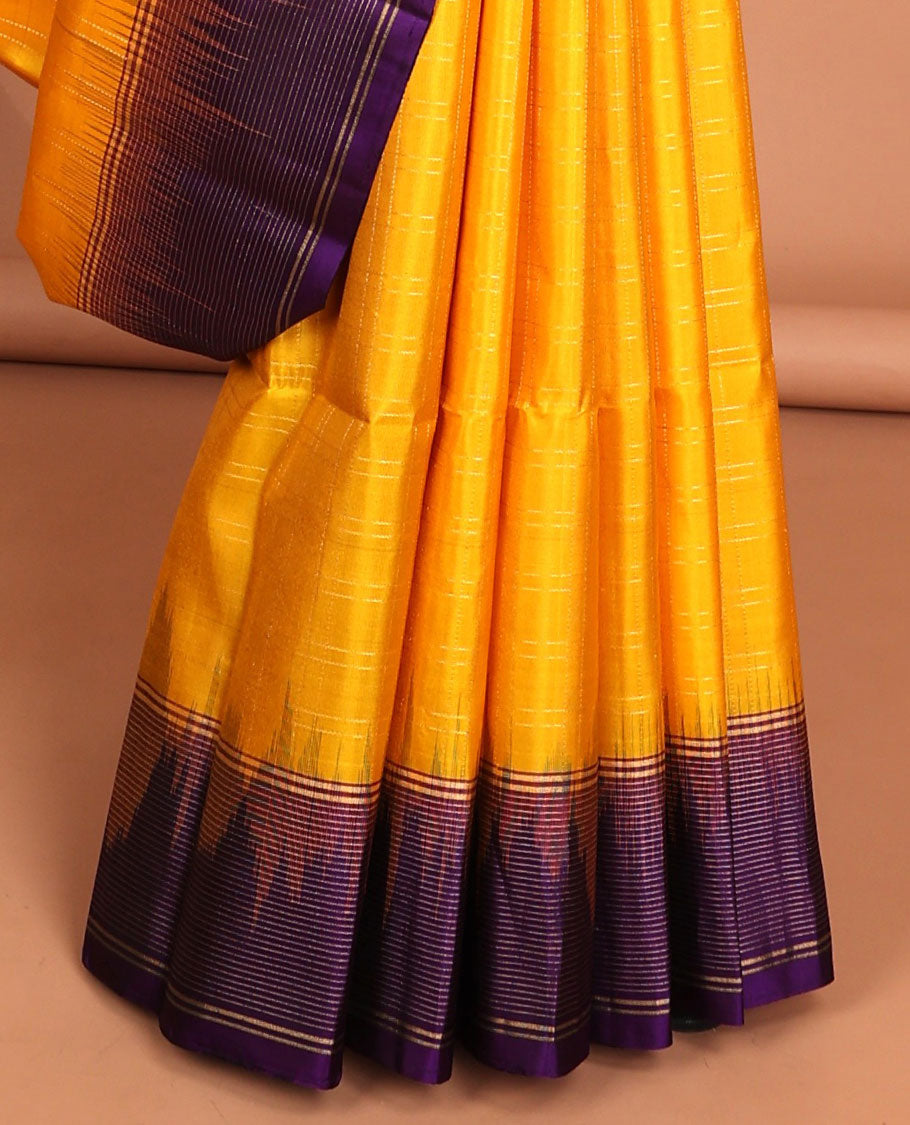 Yellow soft silk saree with contrast striped zari border & intricate zari design pallu