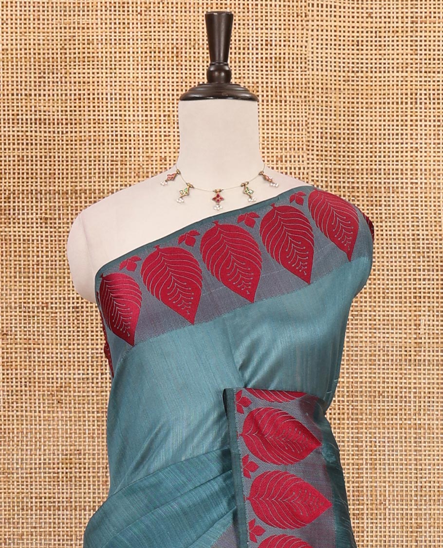 Green plain jute cotton saree , contrast leaf thread butta border & lining seer pallu with tussels