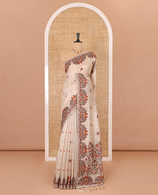 Cream lotus motifs thread woven jute cotton, scallop thread woven border, pallu of lotus, peacock and paisley designs along with a plain blouse