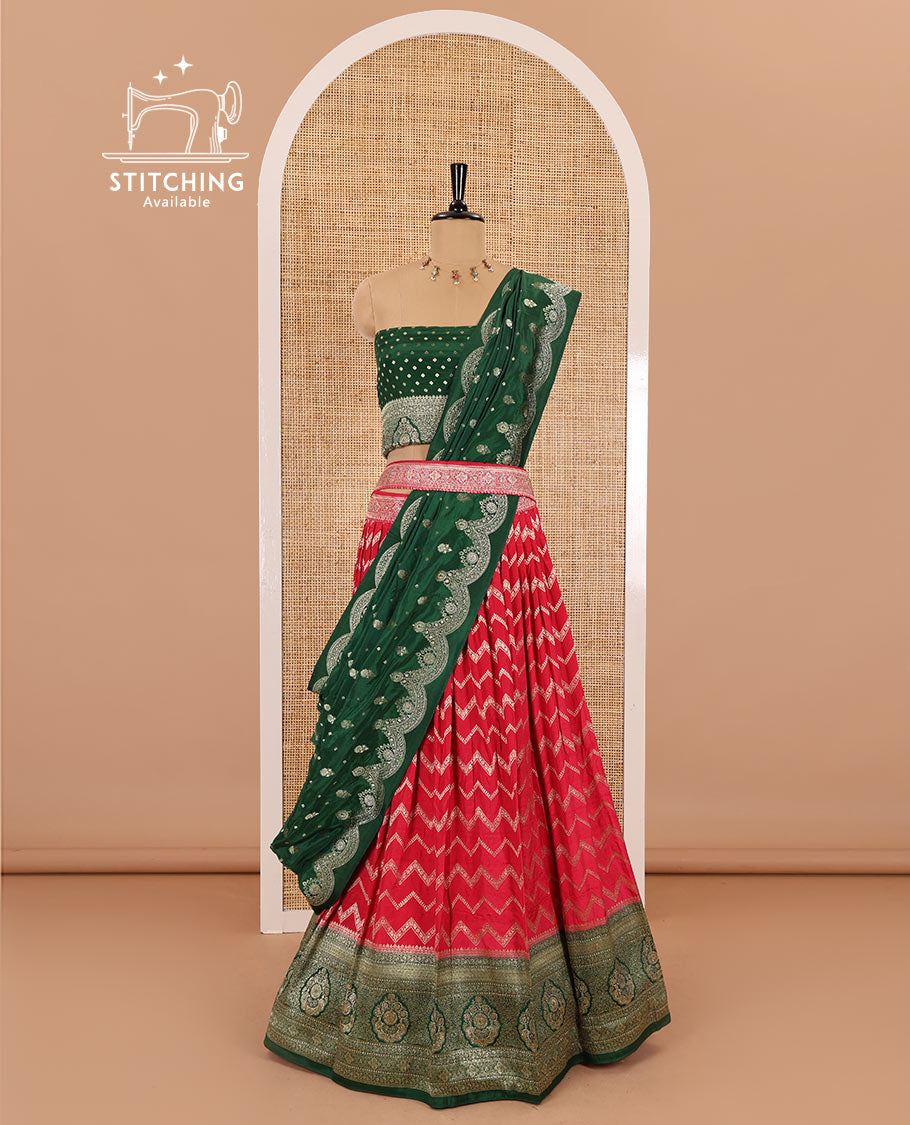 Tomato red chiniya crepe half-saree, chevron zari jacquard with contrast intricate patterned stone work bordered skirt, contrast blouse, and a scallop bordered intricate dhavani