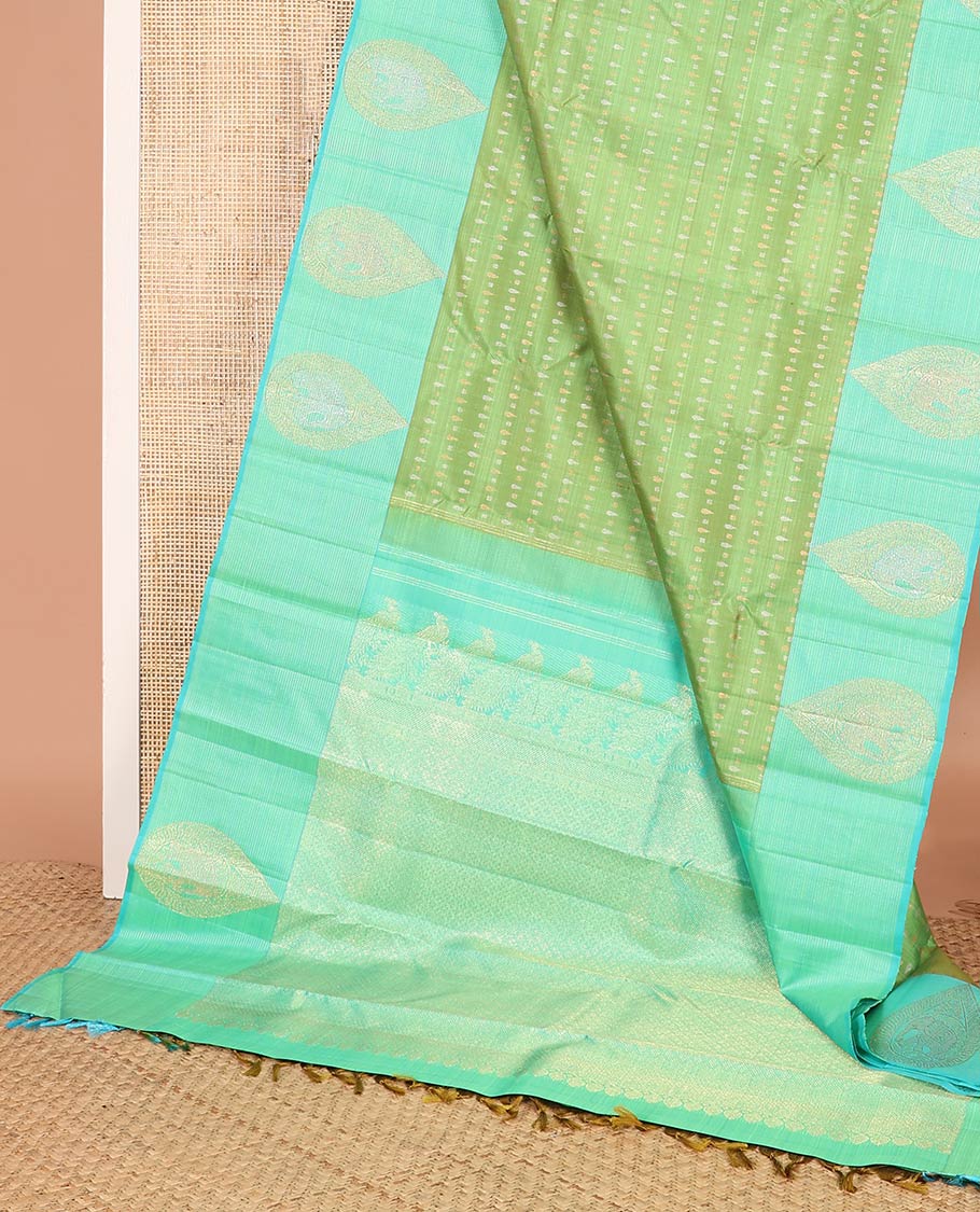 Green zari buttas Kanchipuram designer saree, contrast mayil butta enclosed thilakam design border, and jaal pallu