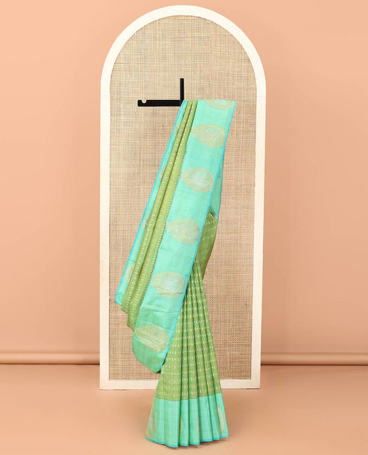Green zari buttas Kanchipuram designer saree, contrast mayil butta enclosed thilakam design border, and jaal pallu