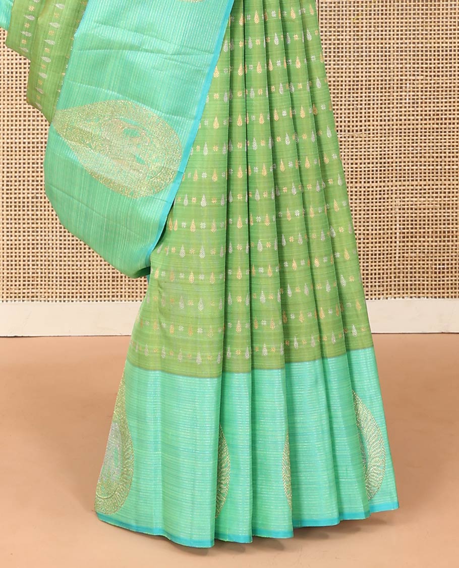 Green zari buttas Kanchipuram designer saree, contrast mayil butta enclosed thilakam design border, and jaal pallu