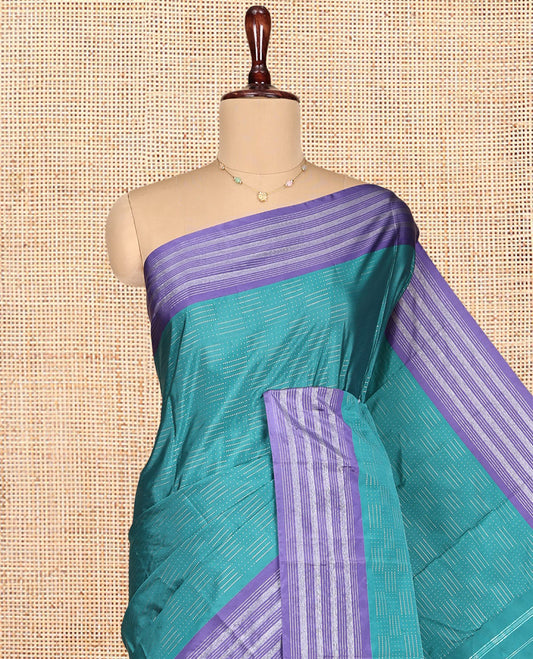 Blue Aarani Gift Saree, Subtly Sparkled with Zari Buttas on Its Body, Complemented by a Contrast-Striped Border, Subtly Striped Pallu, and Paired with a Matching Blouse