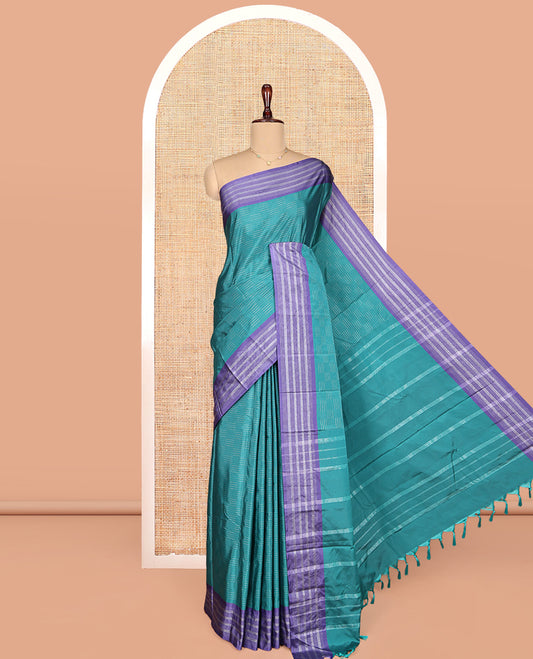 Blue Aarani Gift Saree, Subtly Sparkled with Zari Buttas on Its Body, Complemented by a Contrast-Striped Border, Subtly Striped Pallu, and Paired with a Matching Blouse