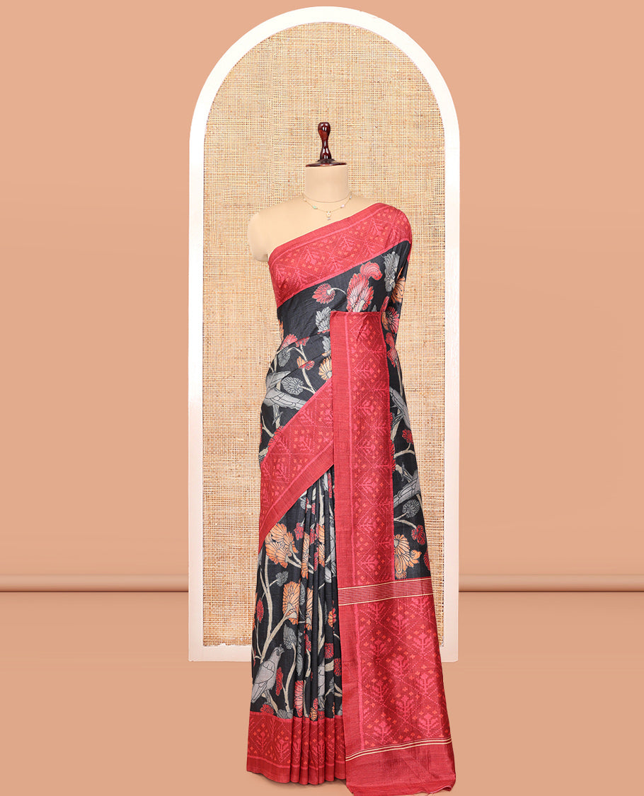 Black Fancy Tussar Saree Features Kalamkari Floral Vine and Bird Print, Contrast Patola Border, Patola Pallu, and a Contrast Blouse