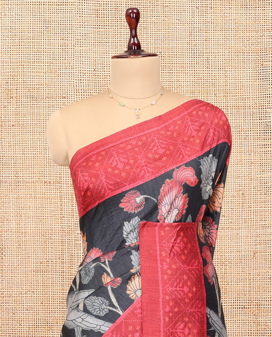 Black Fancy Tussar Saree Features Kalamkari Floral Vine and Bird Print, Contrast Patola Border, Patola Pallu, and a Contrast Blouse