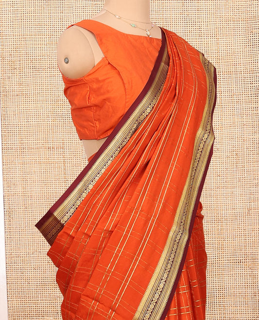 Orange Mysore Silk Saree, Adorned with Zari Checked Design on Its Body, Complemented by a Contrast Traditional Zari Design Border, Pallu Pictures Floral and Bird Designs, and Paired with a Contrast Blouse