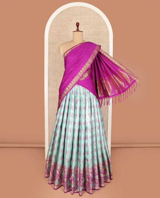 Pale green floral jacquard art silk half-saree saree with contrast meenakari bordered skirt, contrast jacquard blouse, and a contrast zari paisleys woven dhavani