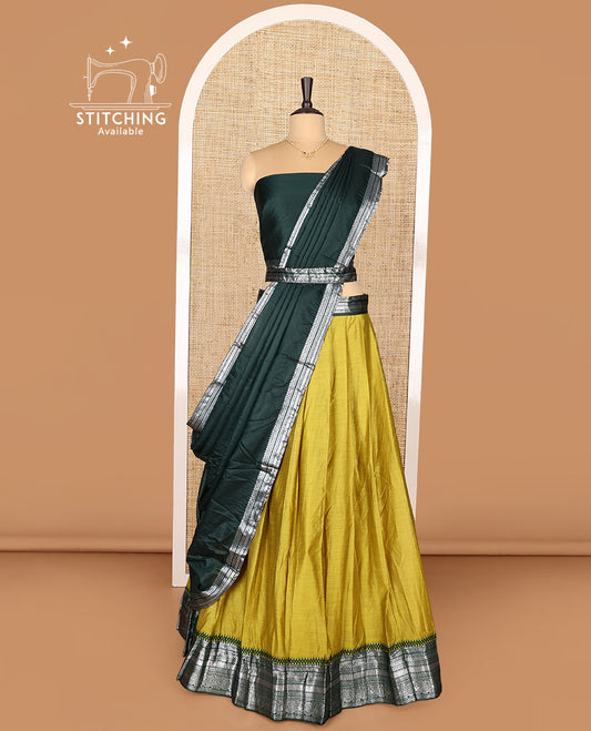 Green Art Silk Half-Saree Featuring Plain Skirt, Complemented by Contrast Traditional Zari Design Border, Paired with a Contrast Blouse, Contrast Zari-Bordered Dhavani, and Brocade Belt