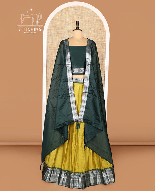 Green Art Silk Half-Saree Featuring Plain Skirt, Complemented by Contrast Traditional Zari Design Border, Paired with a Contrast Blouse, Contrast Zari-Bordered Dhavani, and Brocade Belt