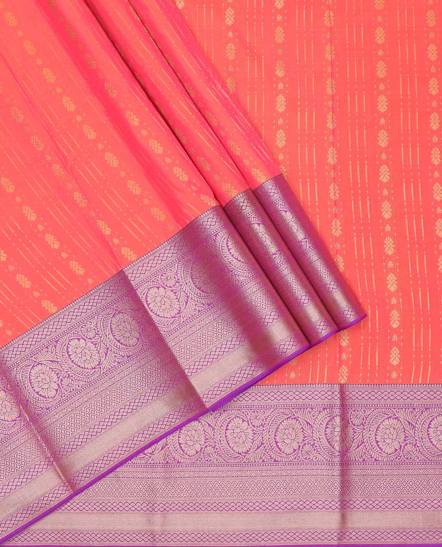 Peach-pink art silk pavadai material, zari design with contrast traditional zari border skirt, a contrast bordered blouse