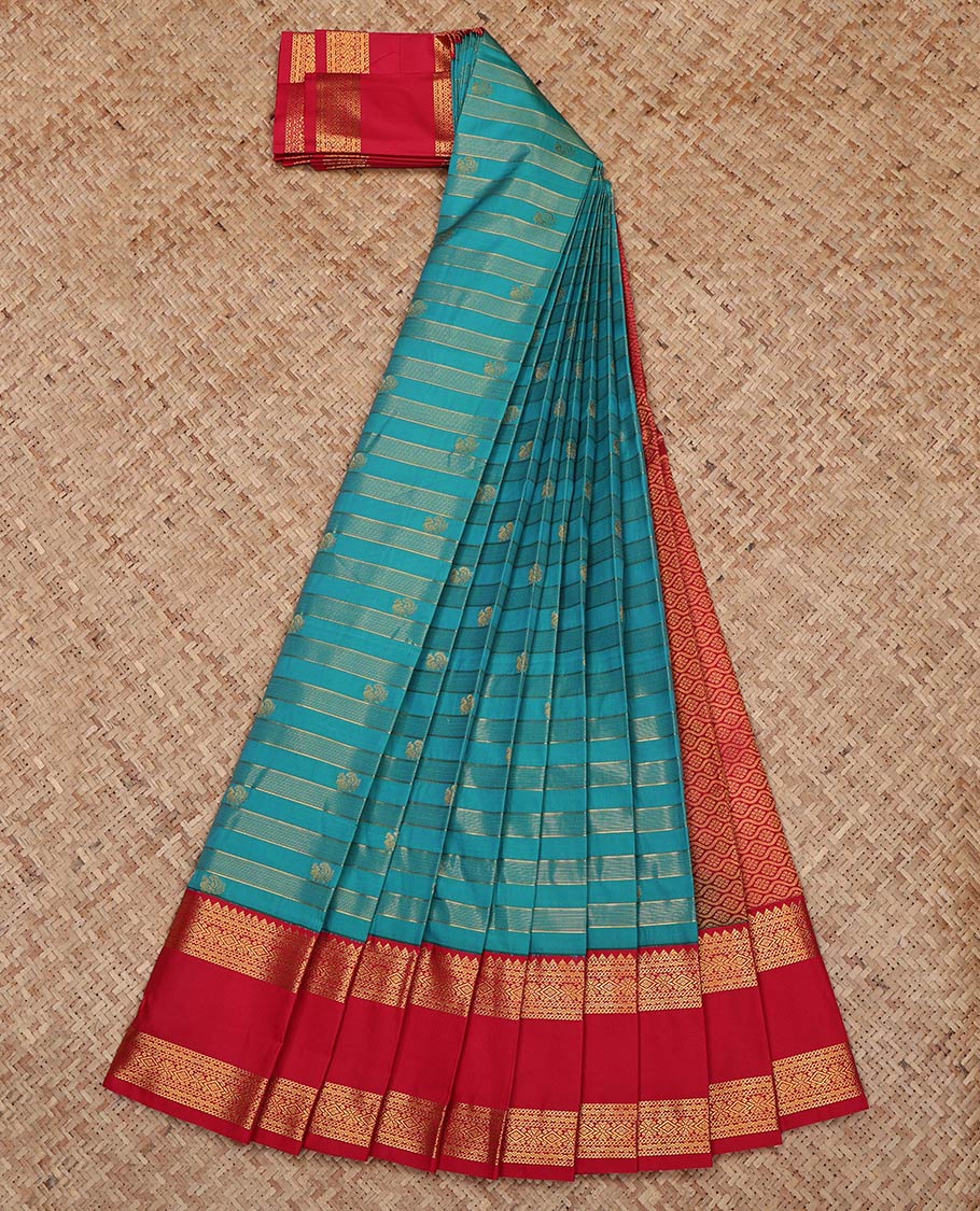 Blue Budget Silk Saree, Gracefully Embellished with Zari Stripes and Peacock Buttas on Its Body, Complemented by Contrast Traditional Zari Design Rettai Pettu Border, Grand Jaal Pallu, and Paired with a Contrast Blouse