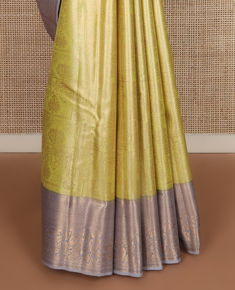 Yellow Mughal style zari jacquard budget silk saree, contrast traditional zari border, and pallu of Mughal inspired intricate motifs