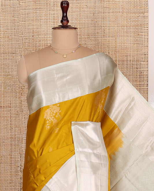 Mustard Budget Silk Saree, Accentuated with Zari Buttas All Over Its Body, Complemented by a Contrast Border of Traditional Zari Designs, Grand Pallu of Intricate Designs, and Paired with a Contrast Blouse