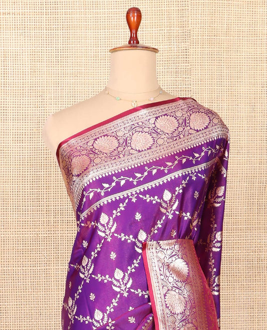 Violet Semi-Banaras Saree, Gracefully Embellished with Jaal Jacquard on Its Body, Highlighted by Floral Creeper Design Border, Intricately Designed Pallu, and Paired with a Matching Blouse
