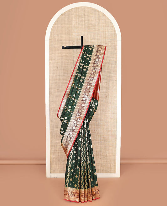 Green zari buttas and leaf vine banarasi silk saree, contrast floral creeper design border, and intricate ogee patterned pallu