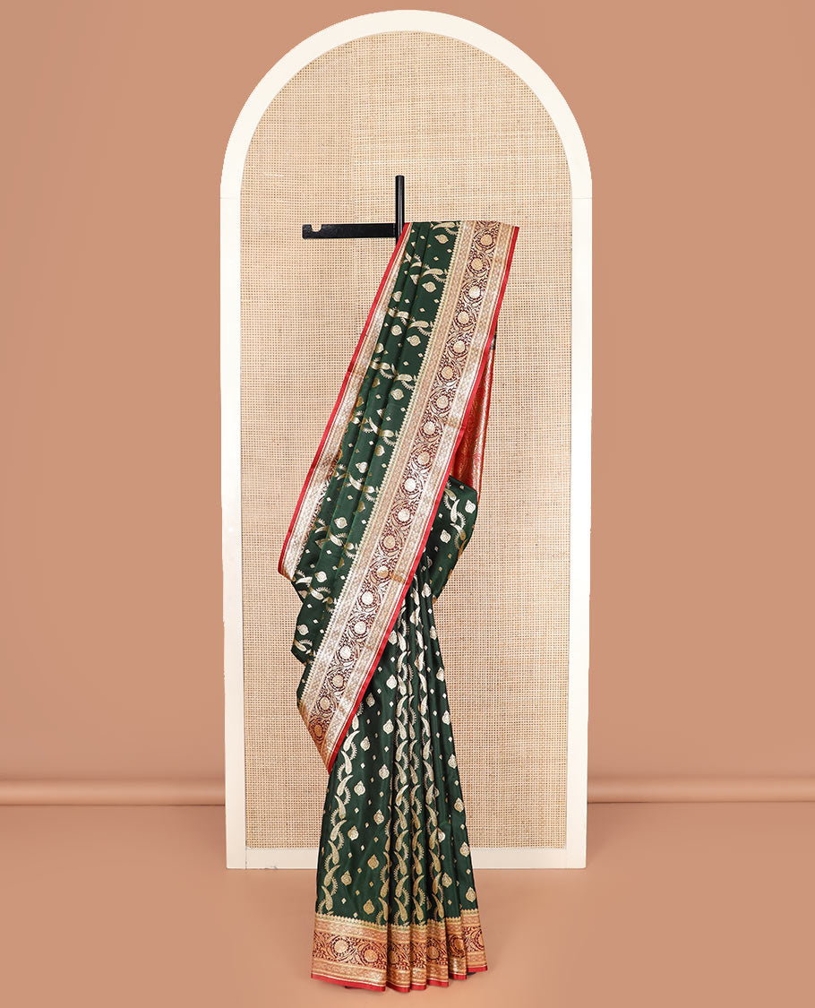 Green zari buttas and leaf vine banarasi silk saree, contrast floral creeper design border, and intricate ogee patterned pallu