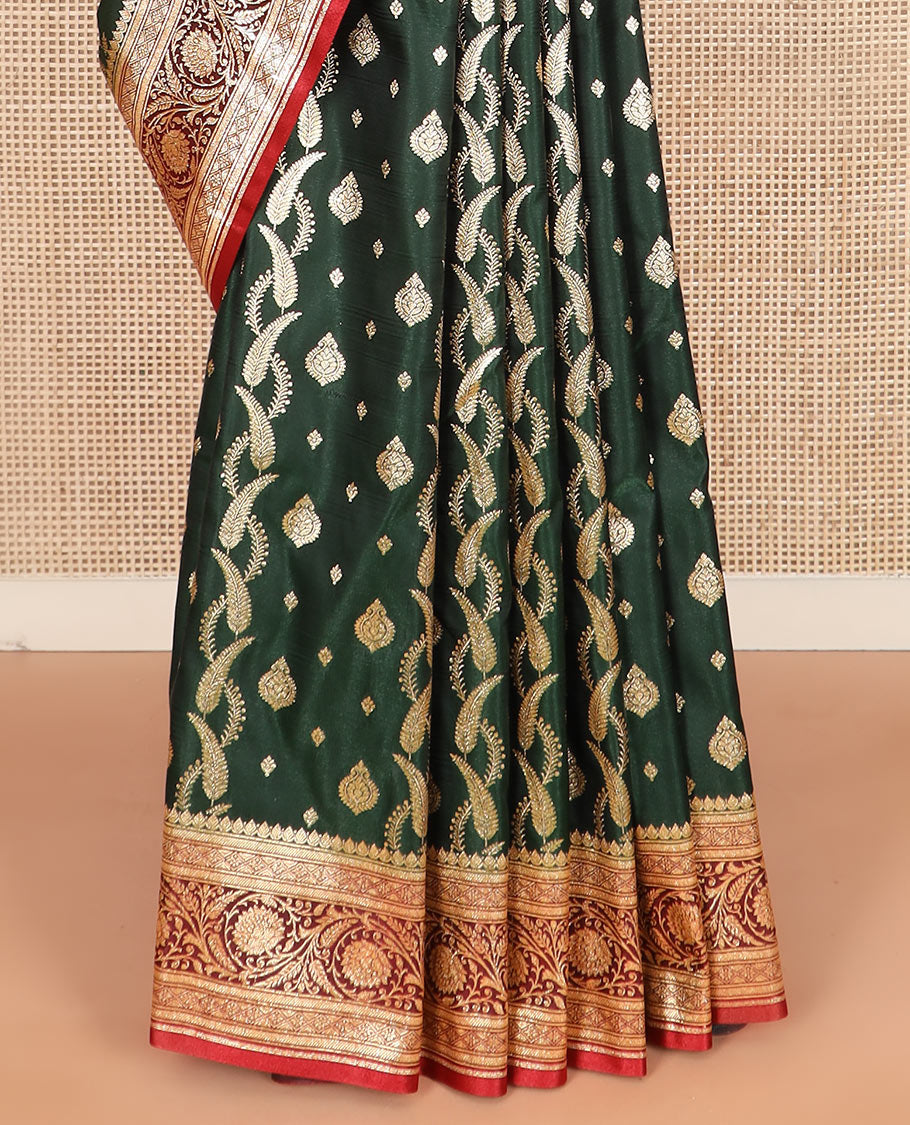 Green zari buttas and leaf vine banarasi silk saree, contrast floral creeper design border, and intricate ogee patterned pallu