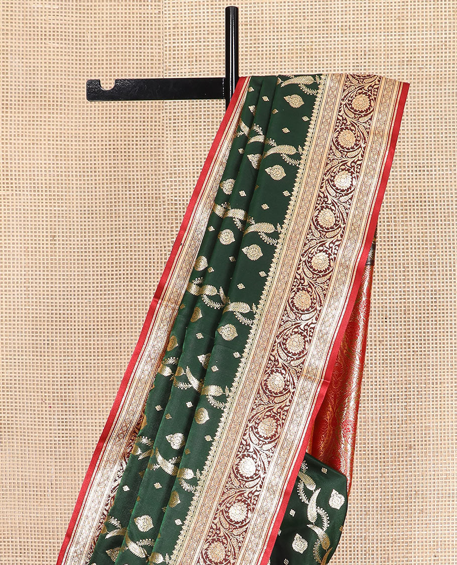 Green zari buttas and leaf vine banarasi silk saree, contrast floral creeper design border, and intricate ogee patterned pallu
