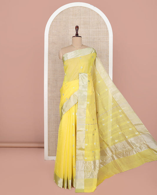 Yellow Chanderi Cotton Saree, Sparkled with Buttas All Over Its Body, Highlighted by a Zari Border, Pallu Steeped with Zari Designs, and Paired with a Matching Blouse