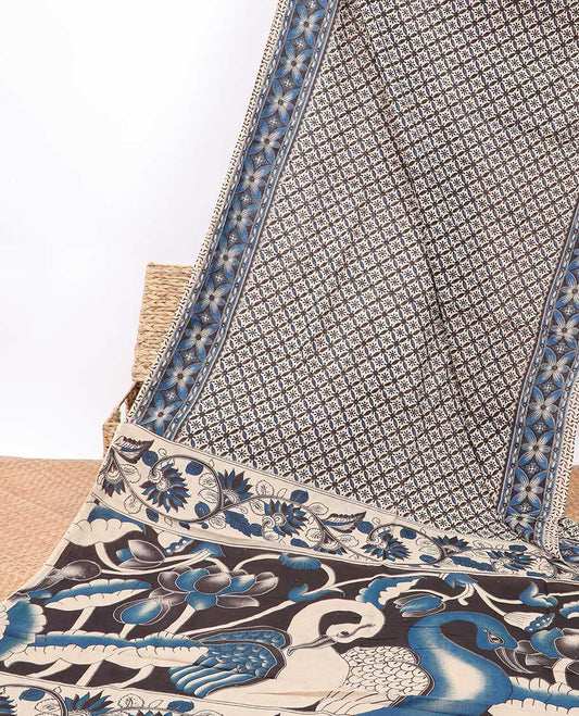 Cream floral enclosed checked design machine-printed kalamkari cotton saree with contrast floral border & peacock design pallu