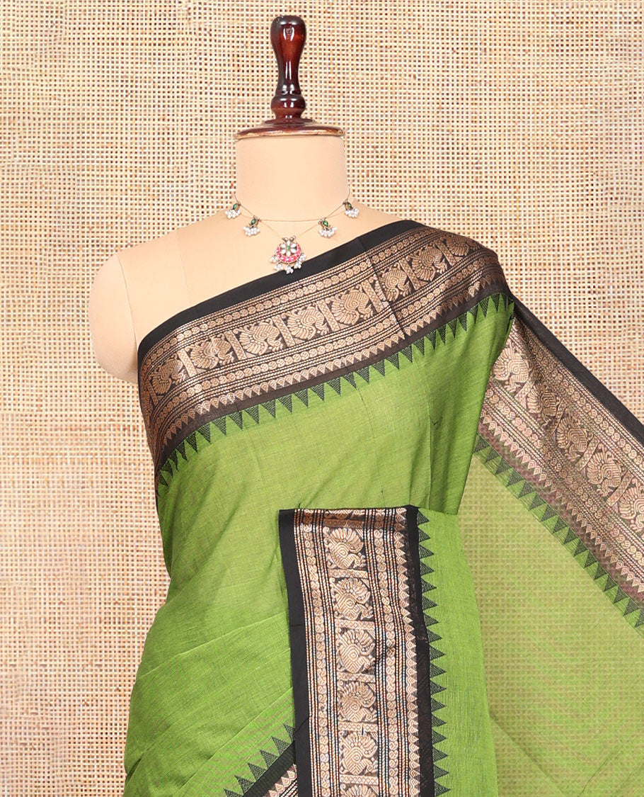 Green Plain Chettinad Cotton Saree, Enhanced by a Contrast Traditional Temple Peacock Border, a Striped Pallu and a Matching Blouse