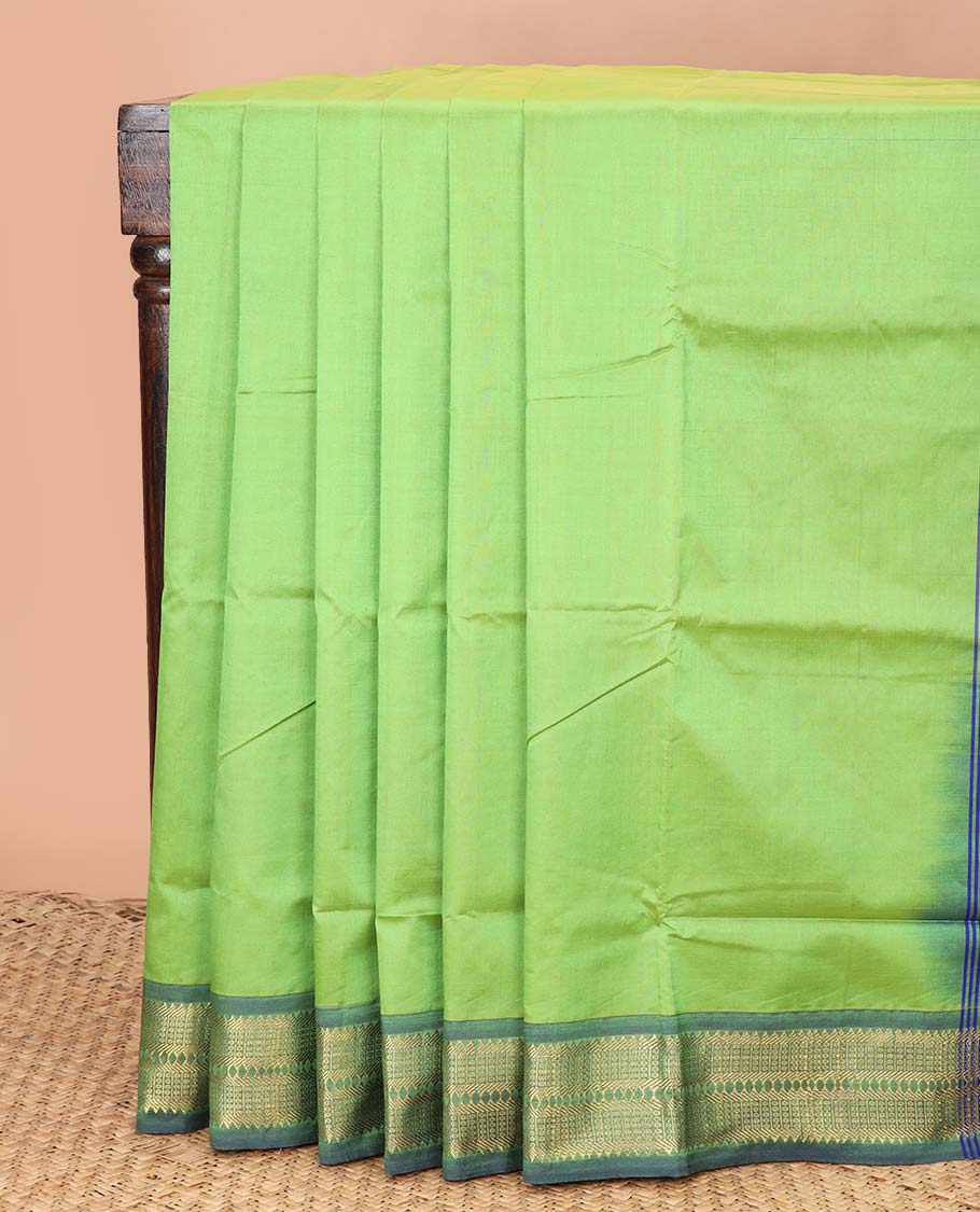 Parrot green plain poly cotton saree, contrast traditional zari border, and striped pallu