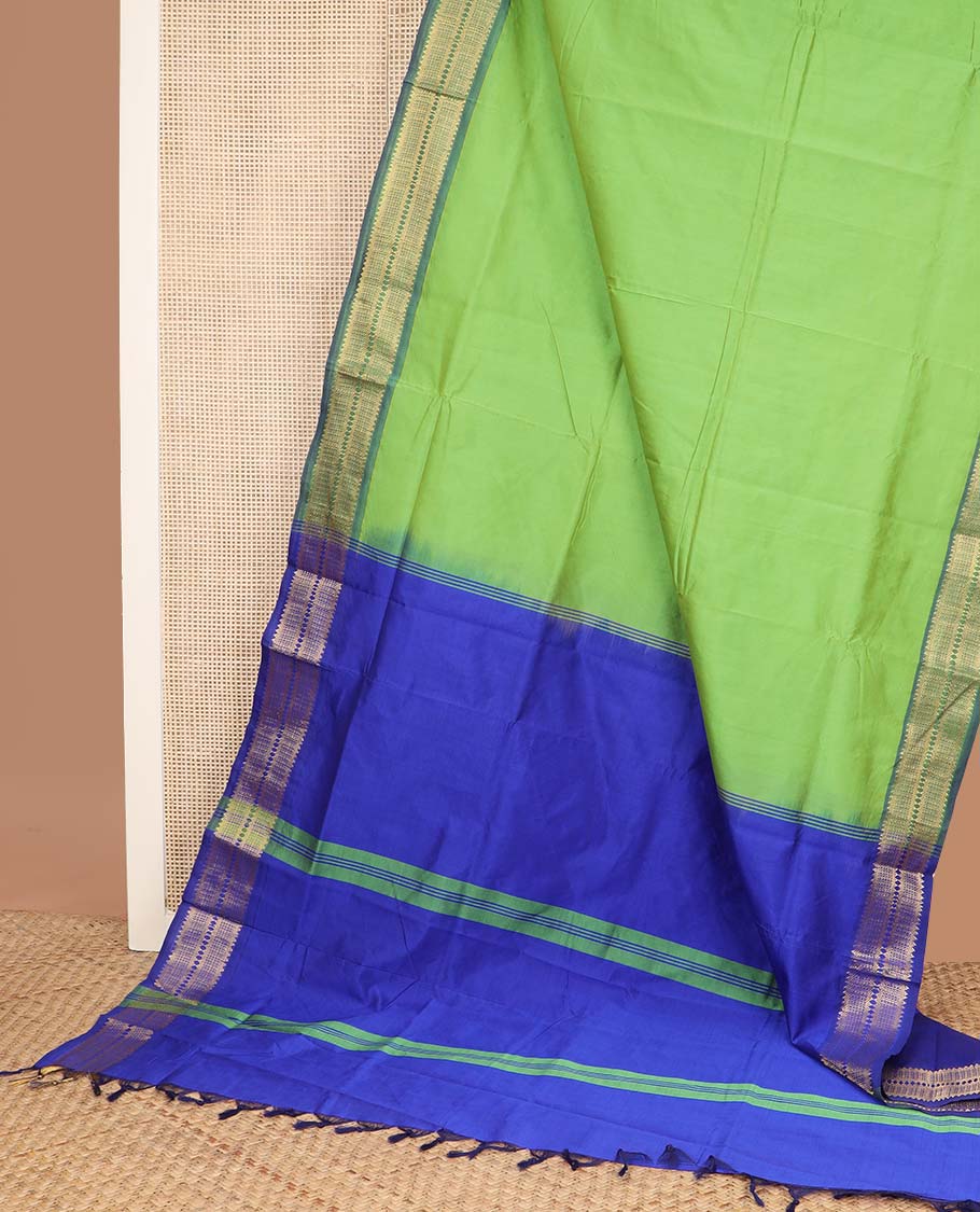 Parrot green plain poly cotton saree, contrast traditional zari border, and striped pallu
