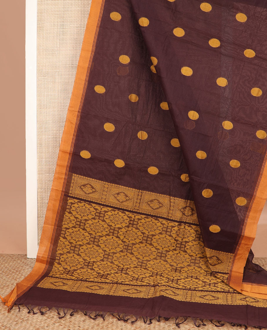 Brown polka dot buttas kanchi cotton saree, contrast border, and chakram design pallu