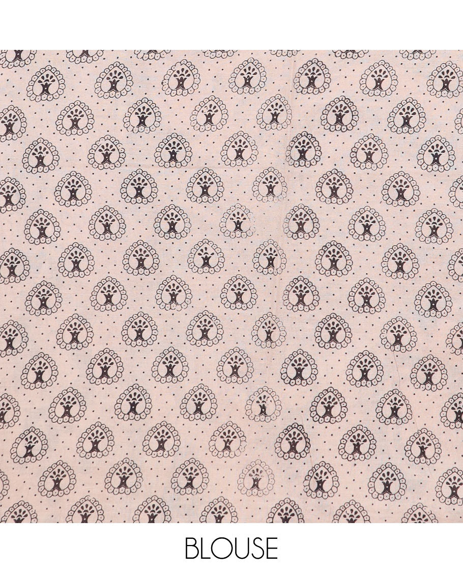 Cream round butta machine-printed kalamkari cotton saree, contrast geometric printed border, and pallu of kalamkari peacocks