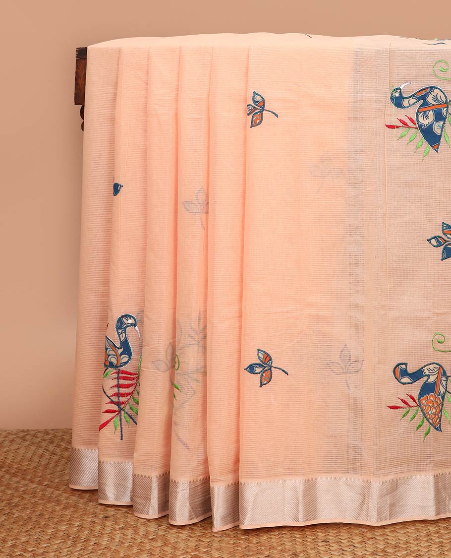 Pastel orange sparsely striped with flamingo patch and thread embroidered chirala cotton saree, temple zari border and pallu of flamingo patch and thread embroidery