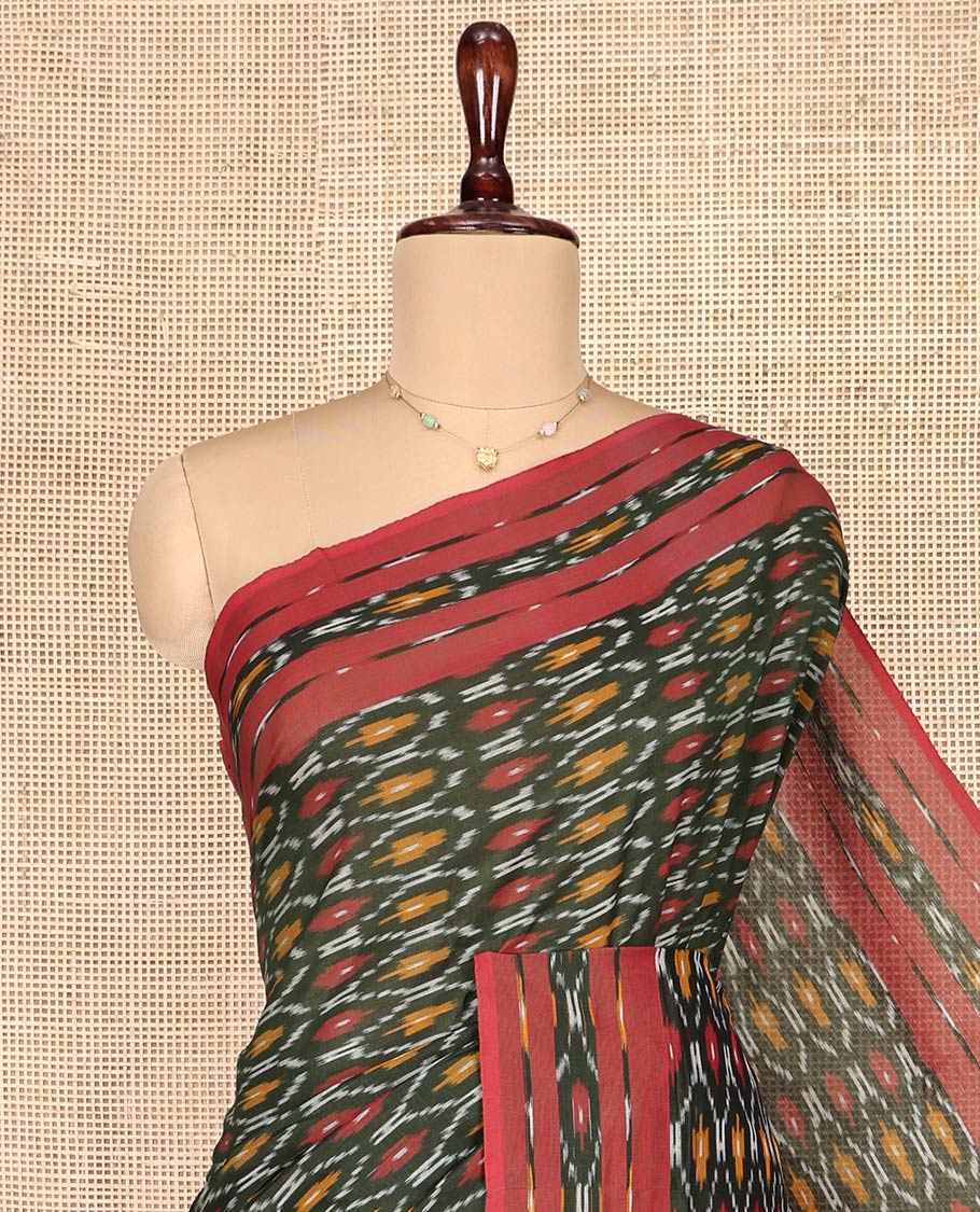 Green Ikkat Cotton Saree, Elevated with Ikkat-Style Ogee Patterns on Its Body, Complemented by Contrast Ikkat-Style Border, Pallu of Ikkat Buttas, and Has No Blouse