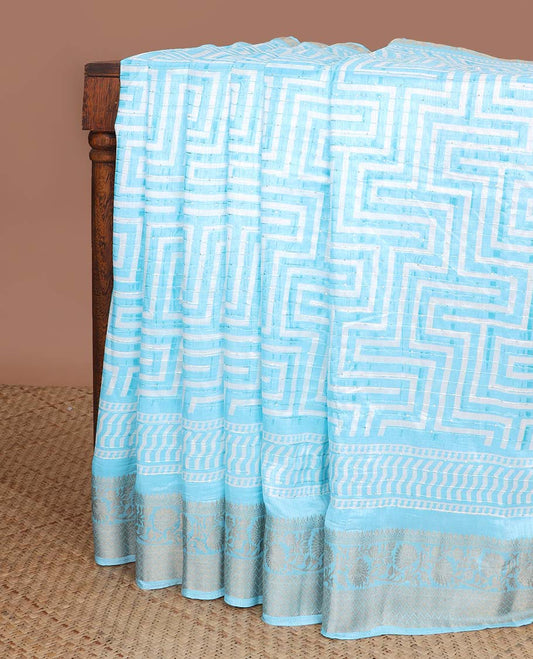 Light blue all-over striped sequins embroidery,  geometric design dola silk saree with self zari design border