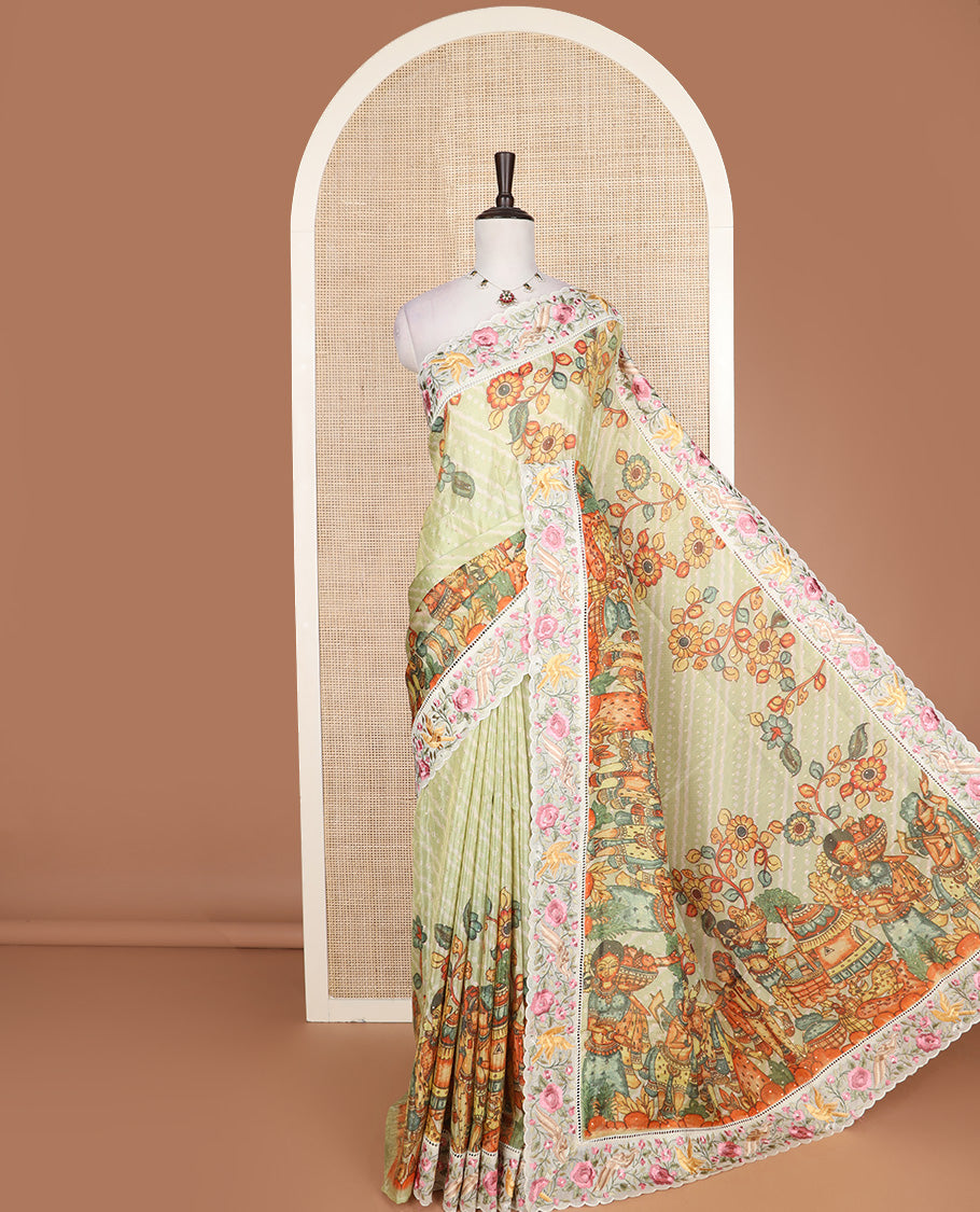 Pastel green buttas with bandhani and kalamkari floral-human motifs printed dola silk saree, contrast floral embroidered scallop border