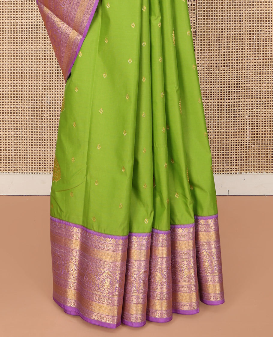 Parrot Green Budget Silk Saree, Embellished with Zari Buttas on Its Body, Complemented by a Contrast Traditional Zari Design Border, Grandly Decked Up Pallu, and Paired with a Contrast Blouse
