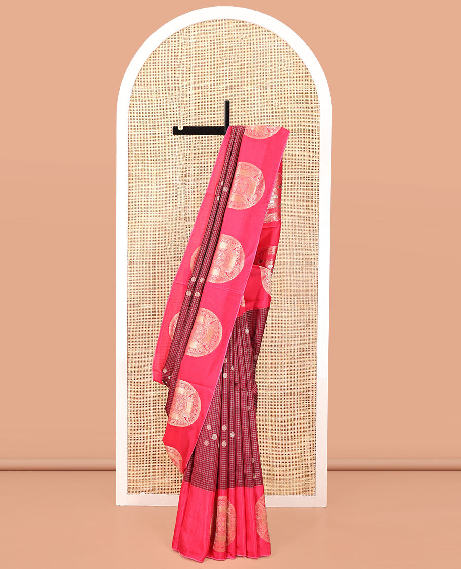 Maroon H O-Silk Saree, Elegantly Detailed with Zari Buttas and Zari Checks On Its Body, Accentuated with Contrast Big Chakram Motifs Woven Border, Grand Jaal Design Woven Pallu, and Paired with a Checked Blouse