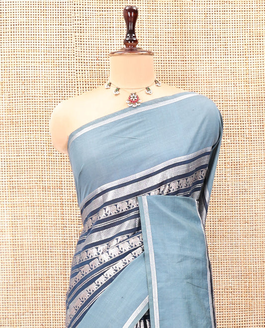 Navy Blue Organza Saree, Richly Zari Detailed with Geometric and Elephant Motifs All Over Its Body, Complemented by Captivating Contrast Zari Border, Zari Decked Up Pallu, and Paired with a Contrast Blouse