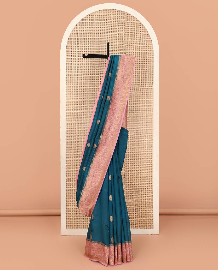 Blue Raw Mango Silk Saree Graced with Buttas, Complemented by a Contrast Traditional Zari-Designed Border, Featuring a Zari-Elevated Pallu, Paired with a Contrast Zari-Striped Blouse