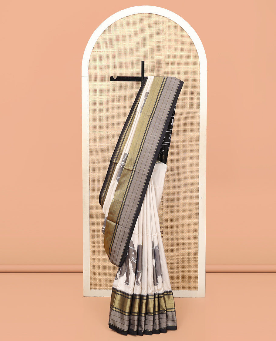 Cream Pochampally Ikat Saree, Adorned with Elephant Motifs, Complemented by a Contrast Traditional Zari Border, Ikat Pallu, and a Contrast Blouse