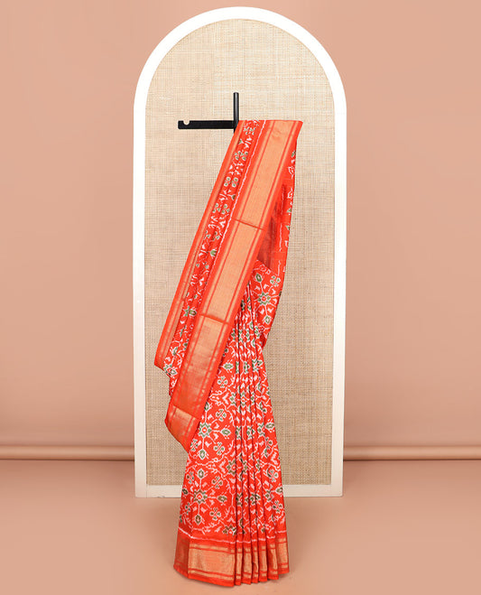 Orange Ikkat Silk Saree Hazily Woven in Ikkat Floral Design Across the Body, Featuring a Zari Border, Pallu of Ikkat Weave, and Paired with a Matching Blouse