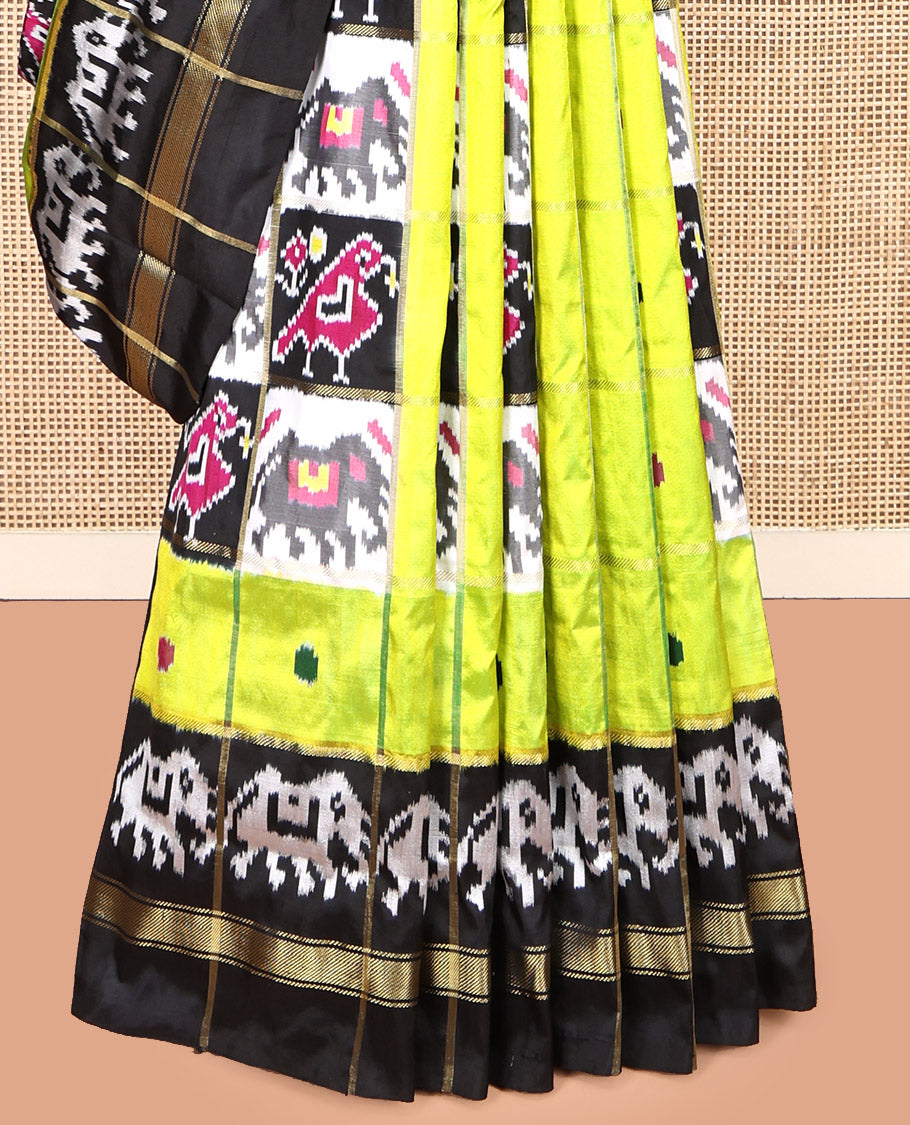 Green Pochampally Ikat Silk Saree, Styled with Patola-Style Animal Butta Enclosed Checks, Complemented by a Contrast Elephant Border, Animal Butta Enclosed Checks Pallu, and Contrast Blouse