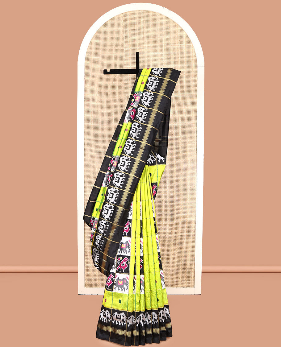 Green Pochampally Ikat Silk Saree, Styled with Patola-Style Animal Butta Enclosed Checks, Complemented by a Contrast Elephant Border, Animal Butta Enclosed Checks Pallu, and Contrast Blouse