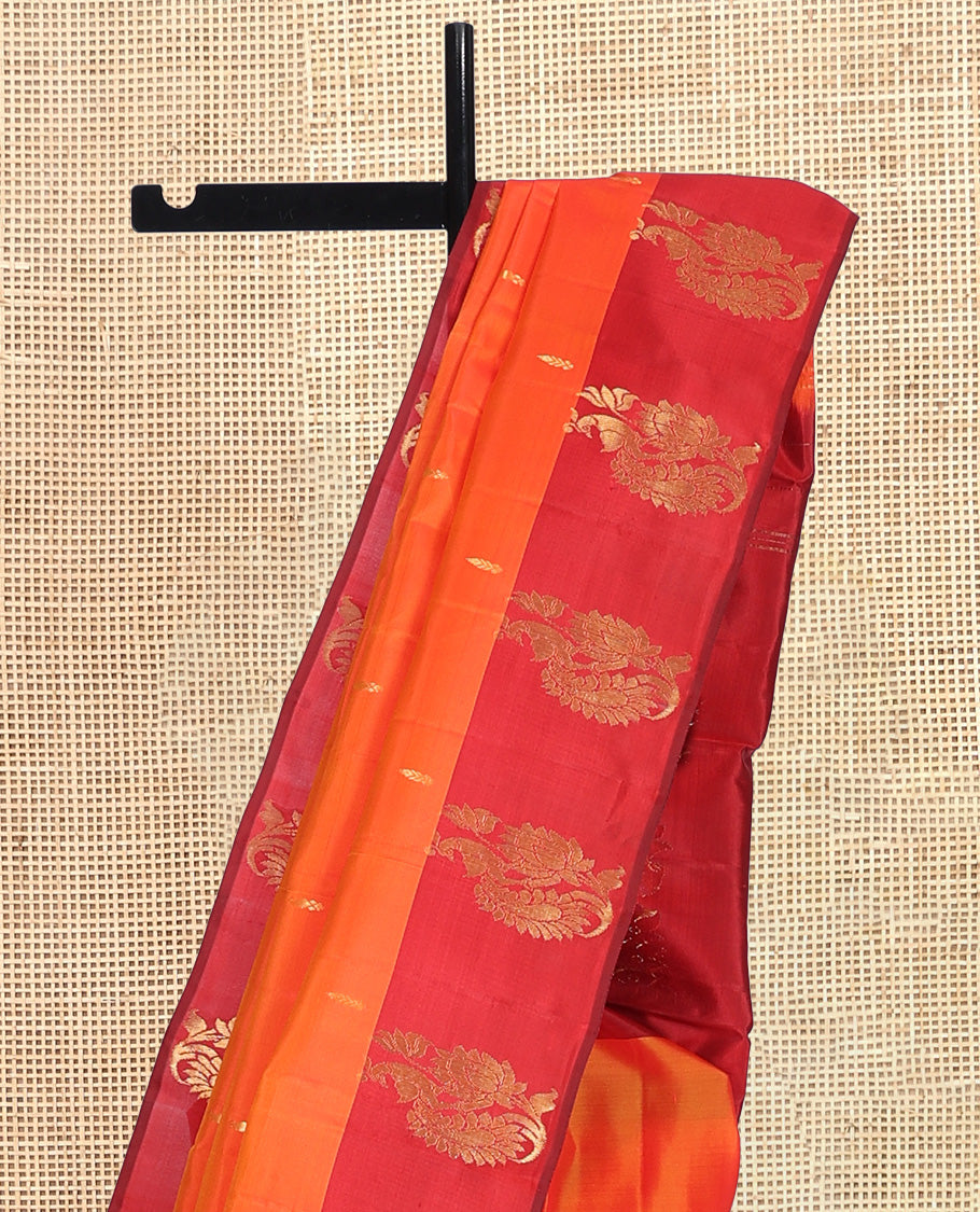 Orange Kanchipuram Silk Saree, Embellished with Zari Buttas, Complemented by a Contrast Mayil Border, Floral Design Pallu, and a Contrast Blouse